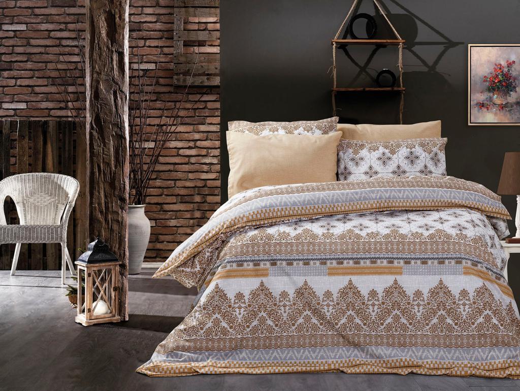 Beige and grey bed linen set with ornamental bands in a bedroom