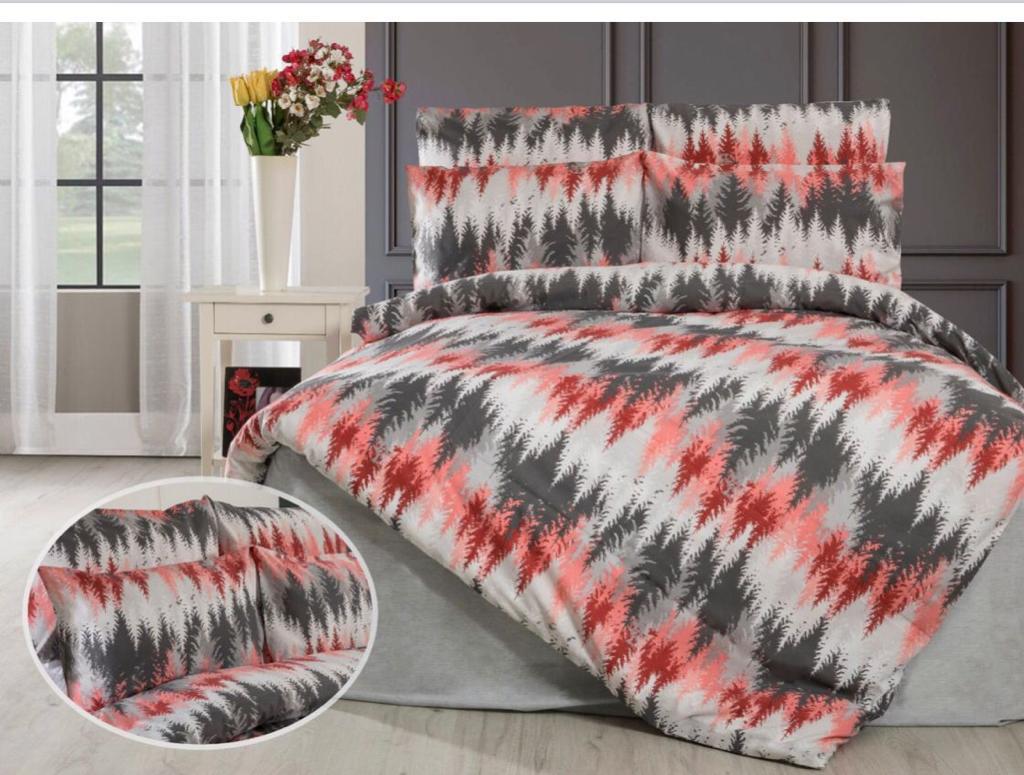 Grey and coral leaf-patterned bed linen set with a close-up of the pattern