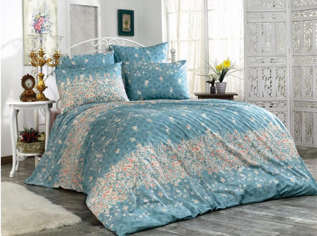 Bed linen set with small flowers on a blue background