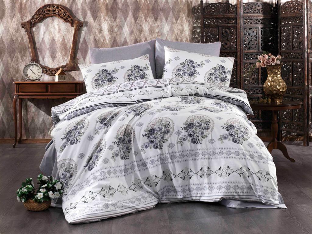 Bed linen set with grey and purple flowers on a white background
